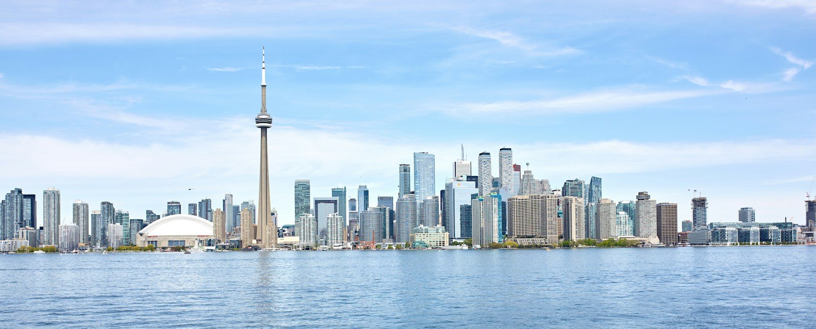 Toronto skyline across Lake Ontario, with the CN Tower and Rogers Centre